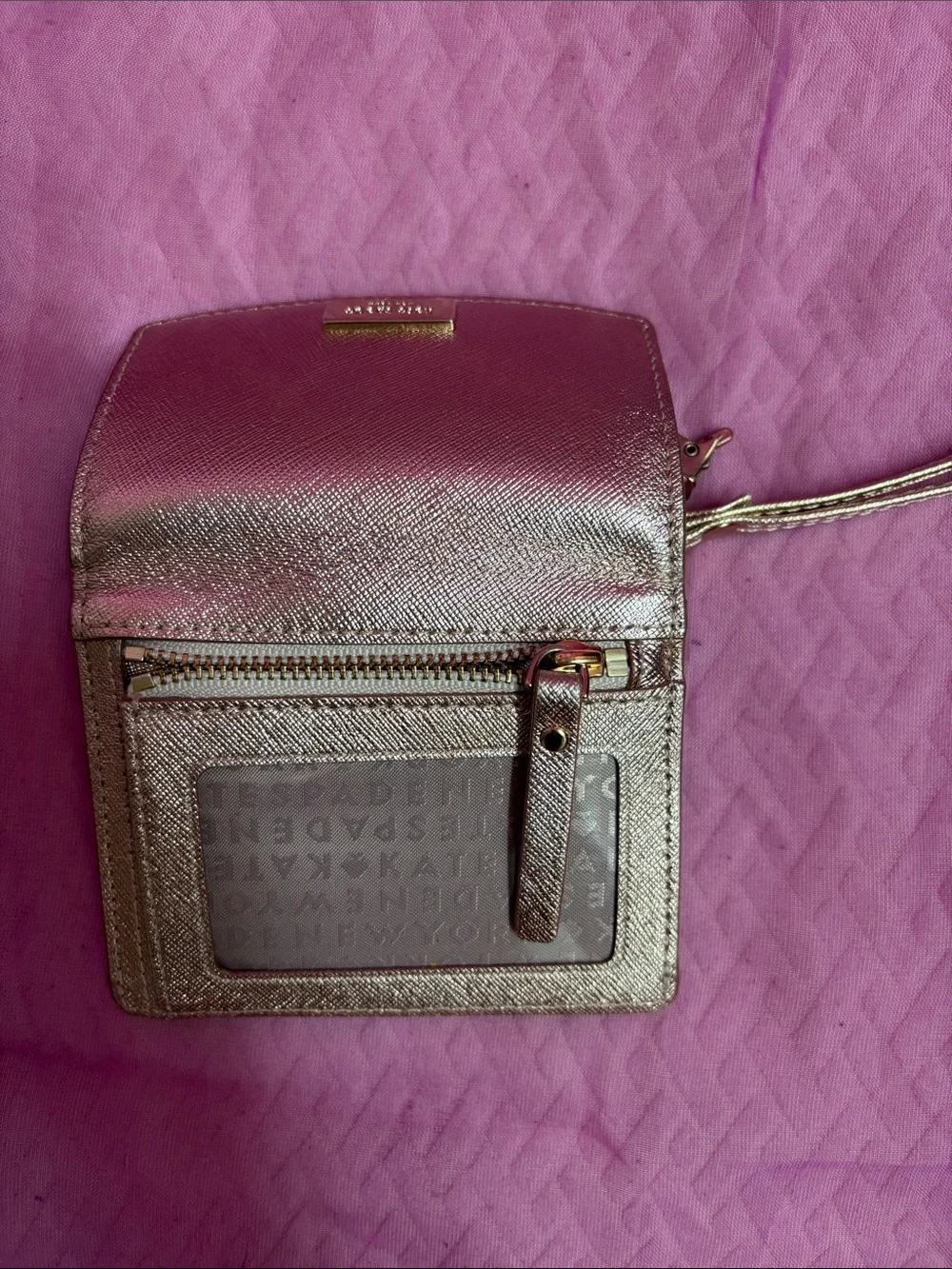 kate spade metallic rose gold wristlet card holder with tassel